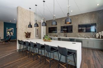 Disconnect to reconnect in the 24hr resident clubhouse lounge and game room with a casual atmosphere and private work pods